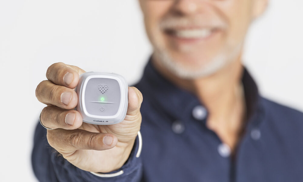 Man holding Coala Heart monitor